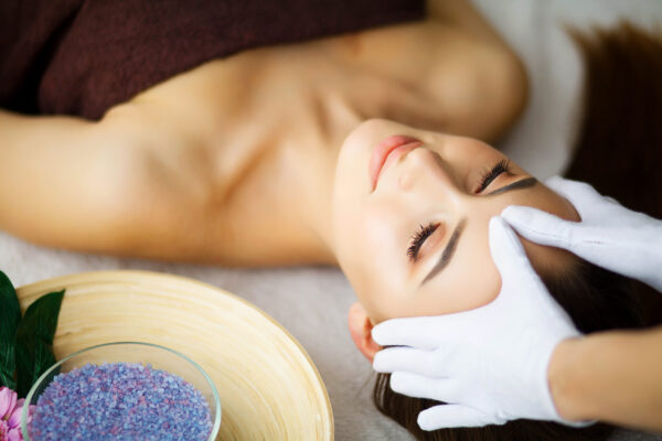 beauty-and-care-young-woman-lying-on-massage-tabl-2023-04-18-16-44-23-utc-scaled-600x400